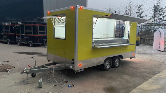 Remolque de comida de acero inoxidable eléctrico personalizado para un servicio de comida conveniente